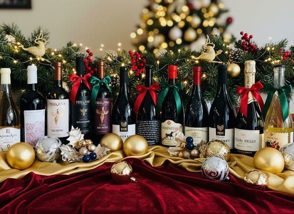 Row of wine bottles on a white surface with decorative elements.